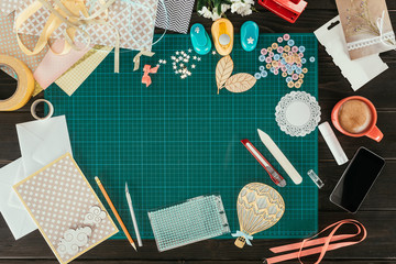 Top view of table with elements for scrapbooking postcard