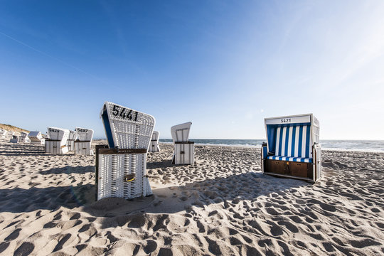 Roofed wicker beach charis at beach, Kampen, Sylt, Schleswig-Holstein, Germany