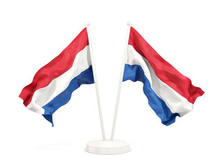 Two waving flags of netherlands