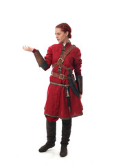 portrait of a red haired girl wearing medieval warrior outfit, studio background.