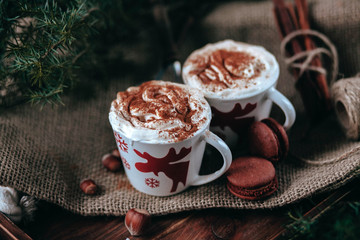 Enamel cup of hot cocoa or coffee for Christmas with whipped cream