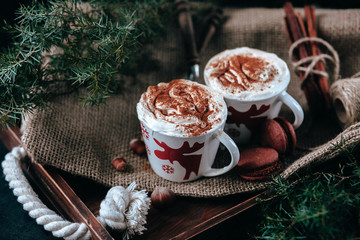 Enamel cup of hot cocoa or coffee for Christmas with whipped cream