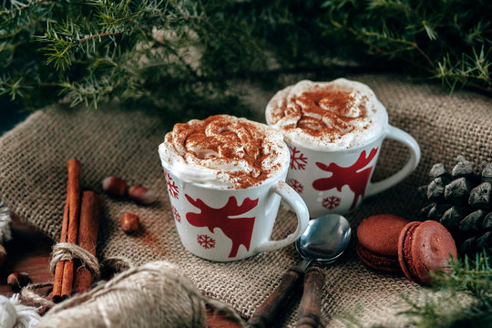 Enamel cup of hot cocoa or coffee for Christmas with whipped cream