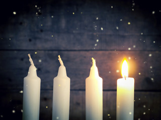 Advent candles on a wooden background