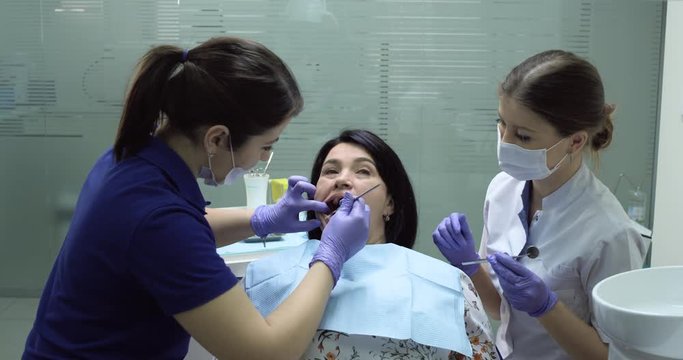 Happy woman patient get ready to make dental X-ray