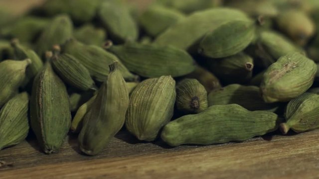 green cardamom on a wooden table. 4k