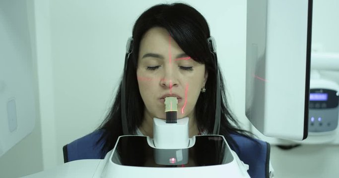 Smiling patient woman making dental X-ray examinations