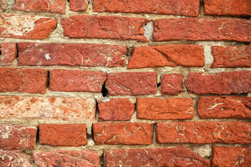Obraz premium A vintage brick wall of a historic building.