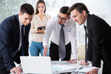 Businesspeople discuss a new project