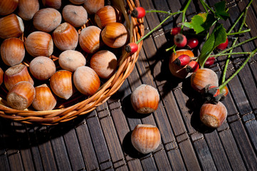 Hazelnut in a basket on a dark background