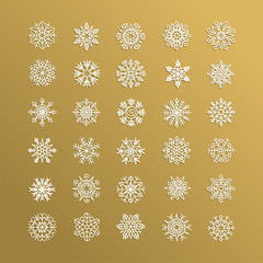 White snowflakes collection isolated on golden background