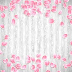 Realistic Sakura petals on a white wooden background. EPS 10 vector