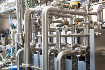 Close-up of pipelines and destillation tanks of an oil-refinery plant