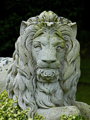 Fototapeta na wymiar Classical head of a majestic lion in stone