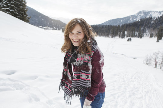 Laughing young woman with snow in hair, Spitzingsee, Upper Bavaria, Germany