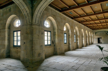 Indoors cloisters corridor in ancient religious building