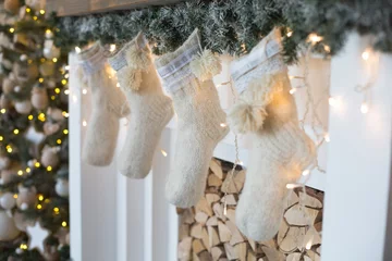 Küchenrückwand glas motiv Three Christmas gift in knitted socks above the fireplace. Happy New Year mood © Кристина Корнеева