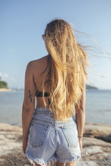Fototapeta na wymiar Woman Vacationer Enjoying Summertime By the Sea