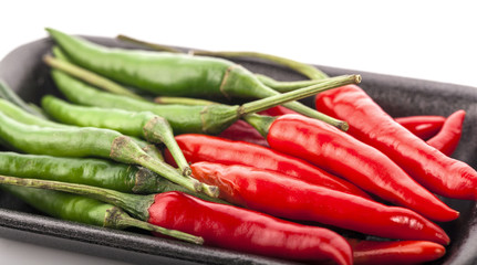 Red and green chili pepper isolated on a white background