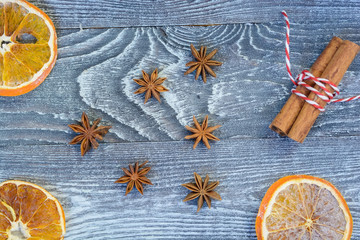 Christmas spices on wooden background