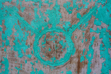 Blue cracked painting on old plaster wall surface