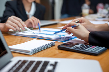 Teamwork process, business people working in the office discussing documents and ideas at meeting
