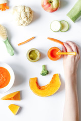 cooking vegetable puree for baby on white background top view