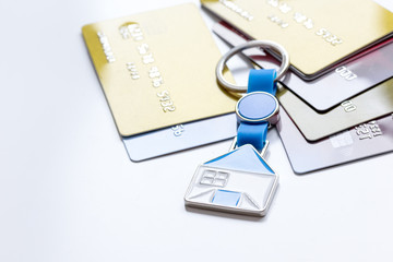 credit cards, key ring - concept mortgage on white background