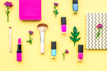 decorative cosmetics on yellow background top view