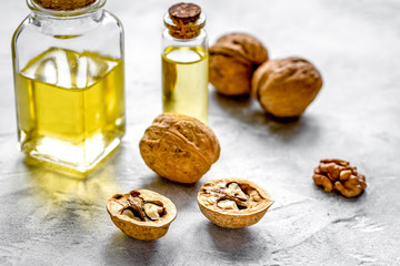 cosmetic and therapeutic walnut oil on gray background