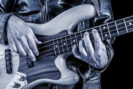 rock bassist playing, blue image