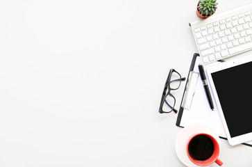 Top view Open Laptop on office desk.cup of coffee and supplies. Top view with copy space.