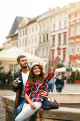 Happy Couple Traveling And Enjoying City Views