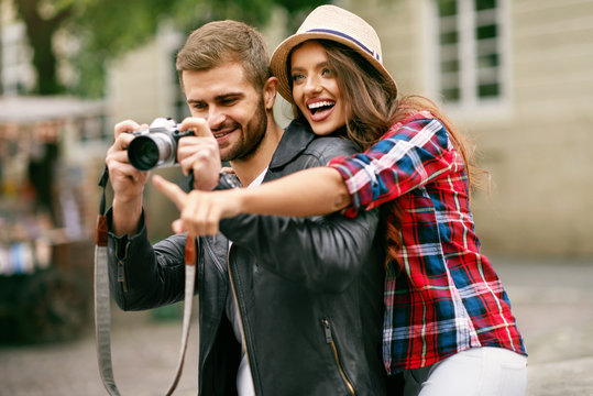 Beautiful Couple Taking Photos On Camera, Traveling