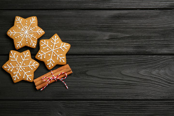Christmas cookies with cinnamon on a black table