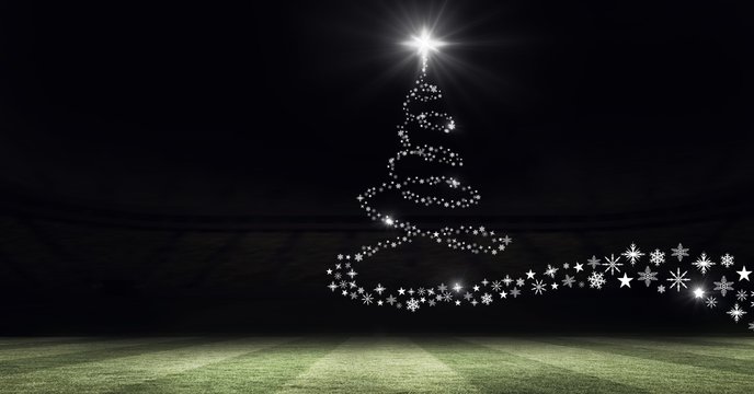 Snowflake Christmas tree pattern shape glowing on sports field