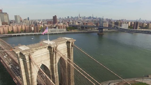 Aerial shot of Brooklyn Bridge, New York City. The camera is moving above Brooklyn bridge in the air approaching to Chinatown and upper Manhattan. 4K, Ultra HD video