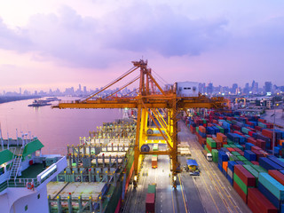 Fototapeta premium container,container ship in import export and business logistic,By crane,Trade Port , Shipping,cargo to harbor.Aerial view,Water transport,International,Shell Marine,transportation,logistic,trade,port