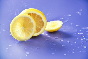 Pieces of Sliced Lemon on Blue Background