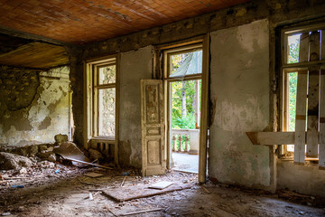 Fototapeta na wymiar Interior of an abandoned mansion