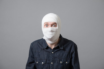 Man with bandage on his head