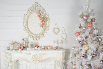 2107747 beautiful Christmas interior in white tones with decorations and decorated the Christmas tree