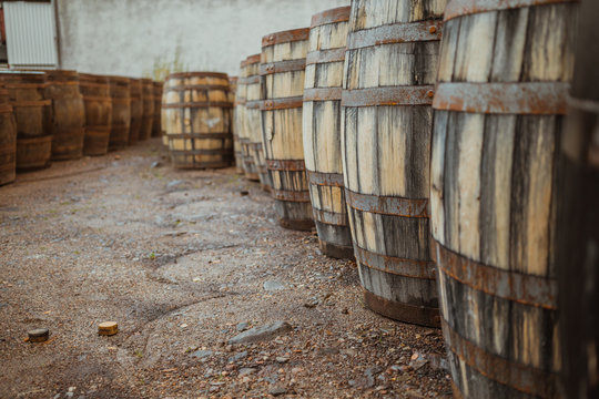 Wooden barrels on stone surface