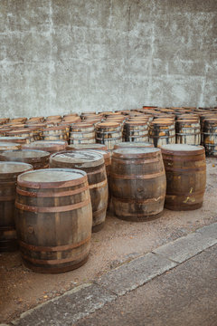 Wooden barrels on stone surface