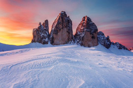 Sexten Dolomites covered in snow in morning light, Italy