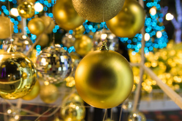Fir branch with balls and festive lights on the Christmas background