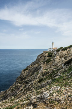 Lighthouse on rocky coast, Punta de Capdepera, Spain