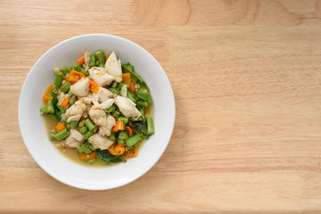 delicious crab meat and chilli stir on wood table