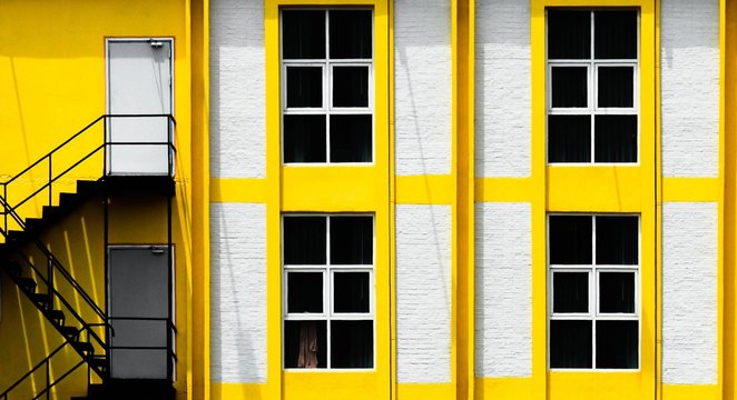 Windows of building with yellow aluminum framework