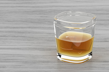 Glass of whisky on wood background